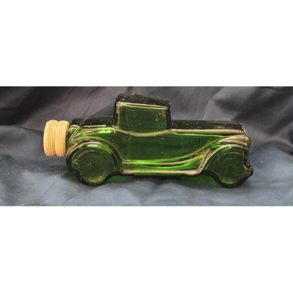 Vintage Avon Green Glass Car Bottle with Yellow Cap